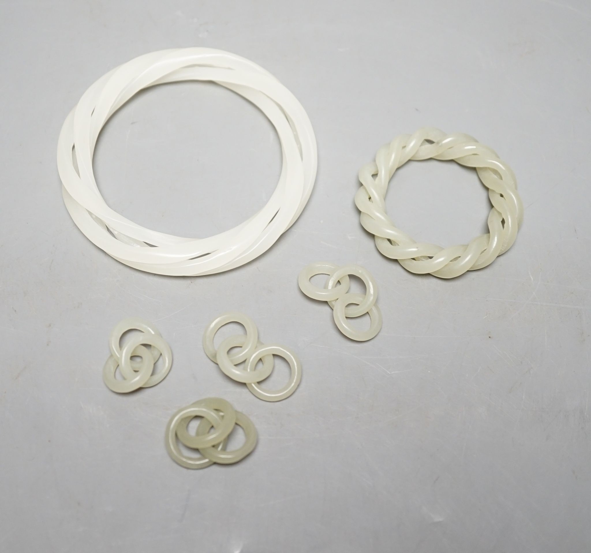 Two Chinese jade corded bangles, and four similar chain sections